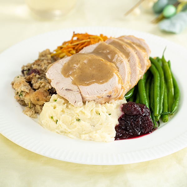 Roasted Turkey Breast with Turkey Gravy, tart Cranberry Ginger Sauce, rustic Cranberry Apple Sausage Stuffing , Mashed Potatoes and Green Beans