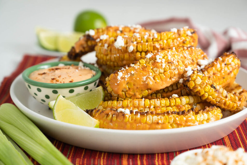 Grilled Mexican-style corn ribs with chipotle mayonnaise and cotija cheese for Cinco de Mayo