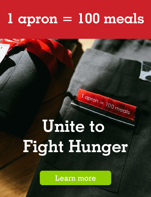 background with Farm Boy edition aprons. Let us unite to fight hunger. 1 apron = 100 meals.