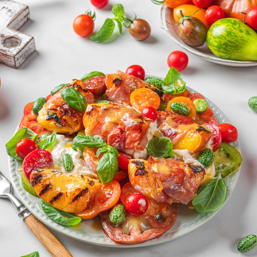 Warm Salad with Grilled Peaches, Vegetables, and Cheese.