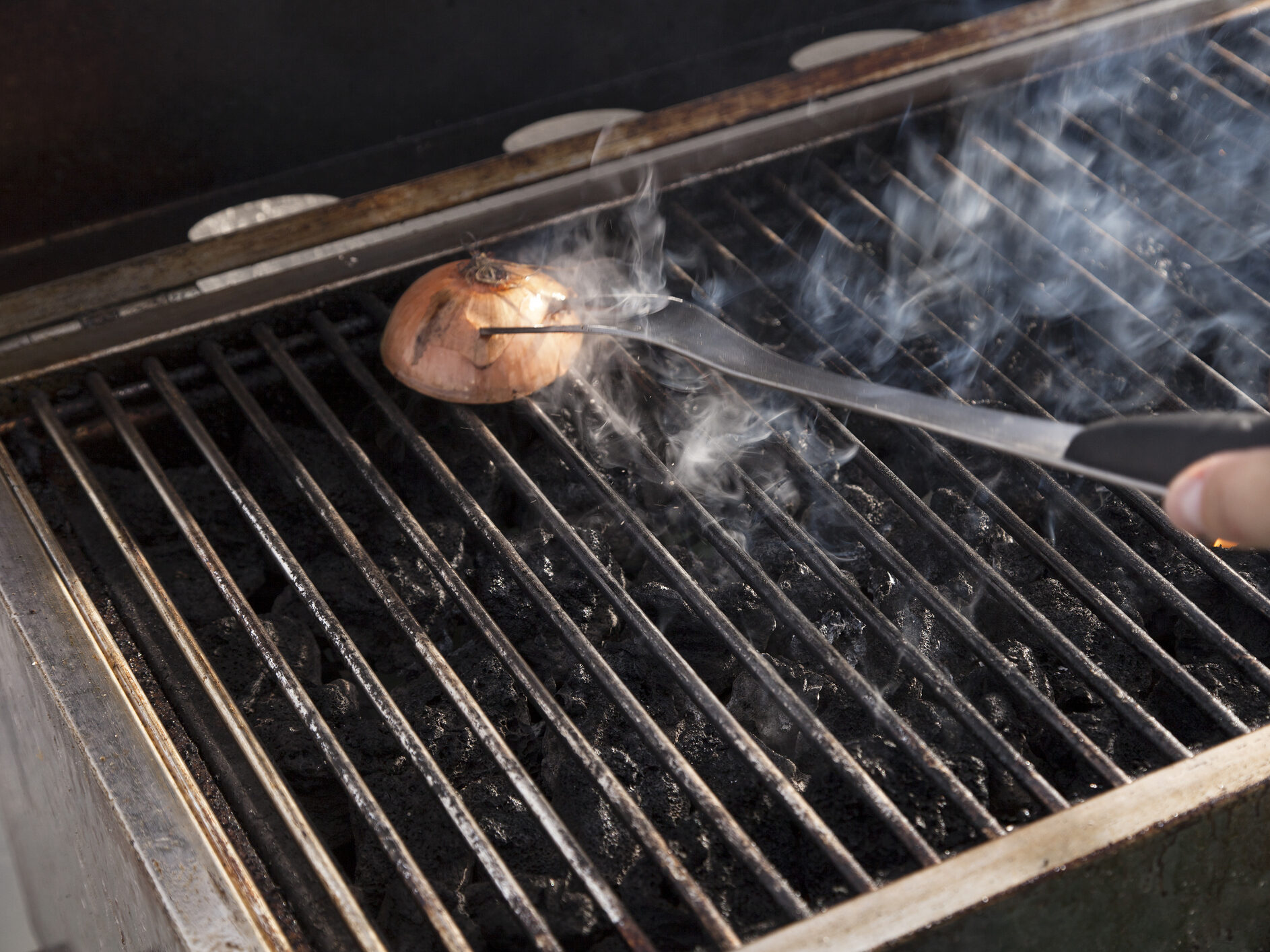 Using onion and grill fork to clean grates