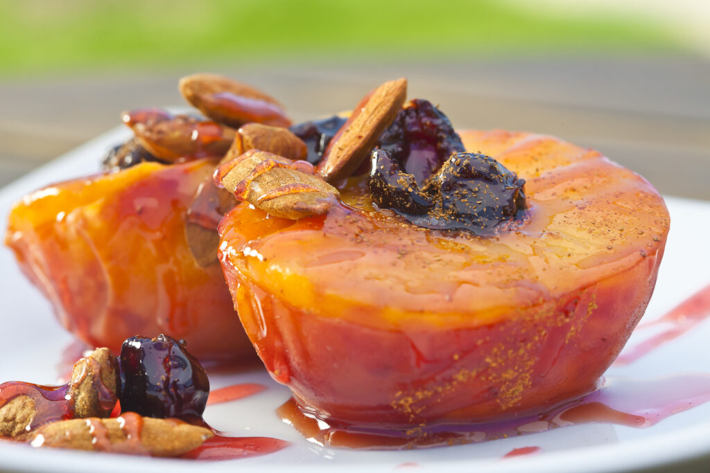 Peaches poached in wine with cinnamon and almonds.