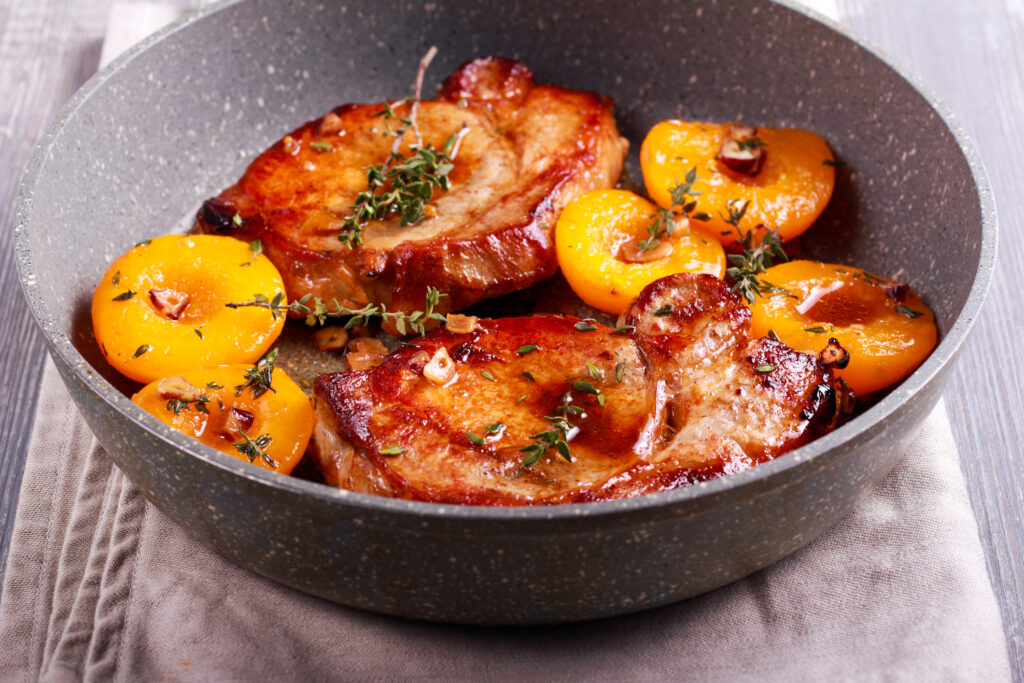 Pork chops with thyme and peaches.