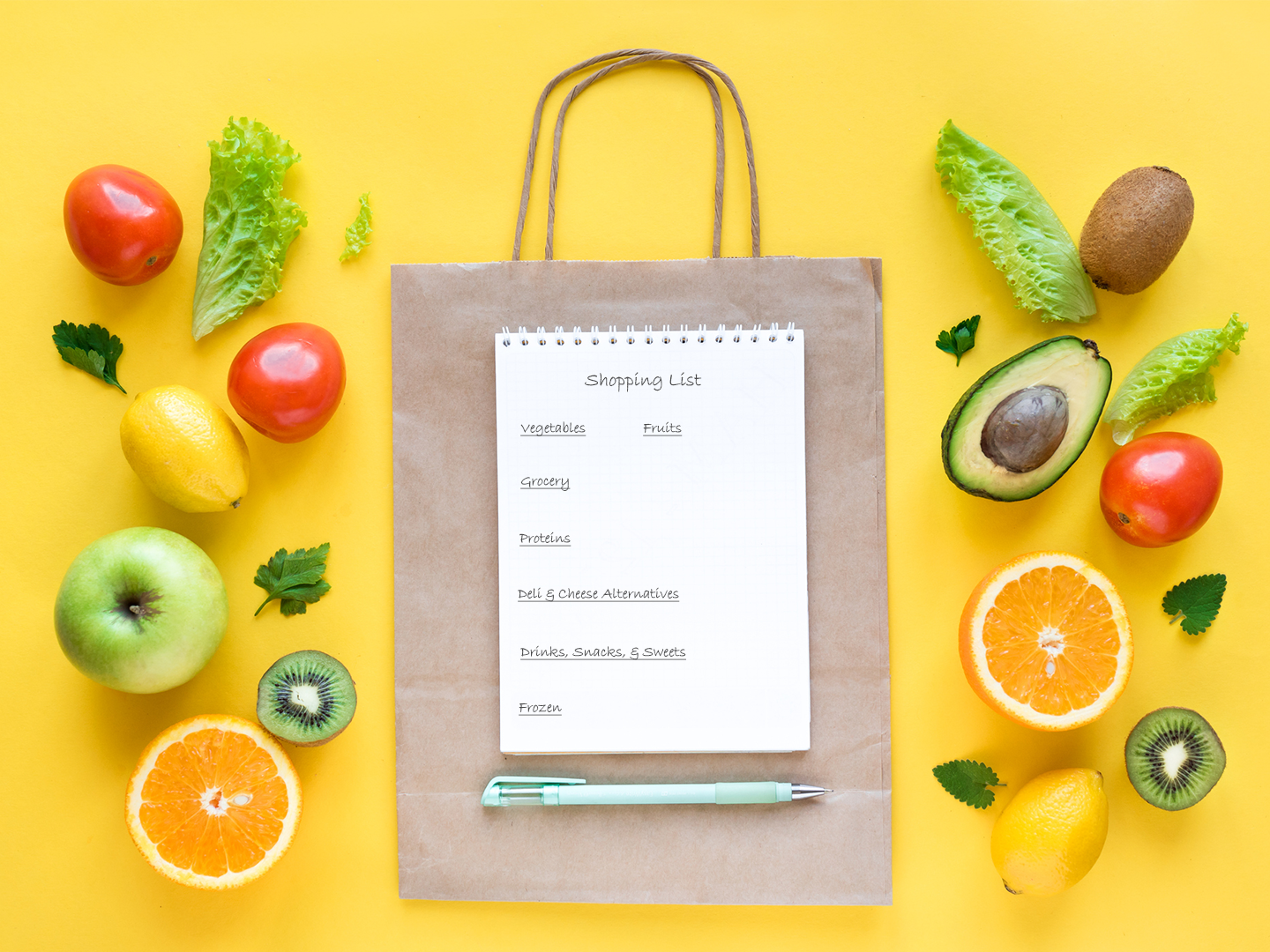 Grocery shopping list with produce surrounding.