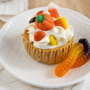 Mini Pumpkin Spiced Halloween Cheesecake is a delightful and festive dessert perfect for the spooky season. These individual-sized cheesecakes feature a creamy, velvety pumpkin-flavored filling infused with warm spices like cinnamon, nutmeg, and cloves. Topped with a dollop of whipped cream or a sprinkle of cinnamon, they offer a taste of autumn in every bite. The small size makes them ideal for Halloween parties or gatherings, adding a touch of seasonal charm to your celebrations.