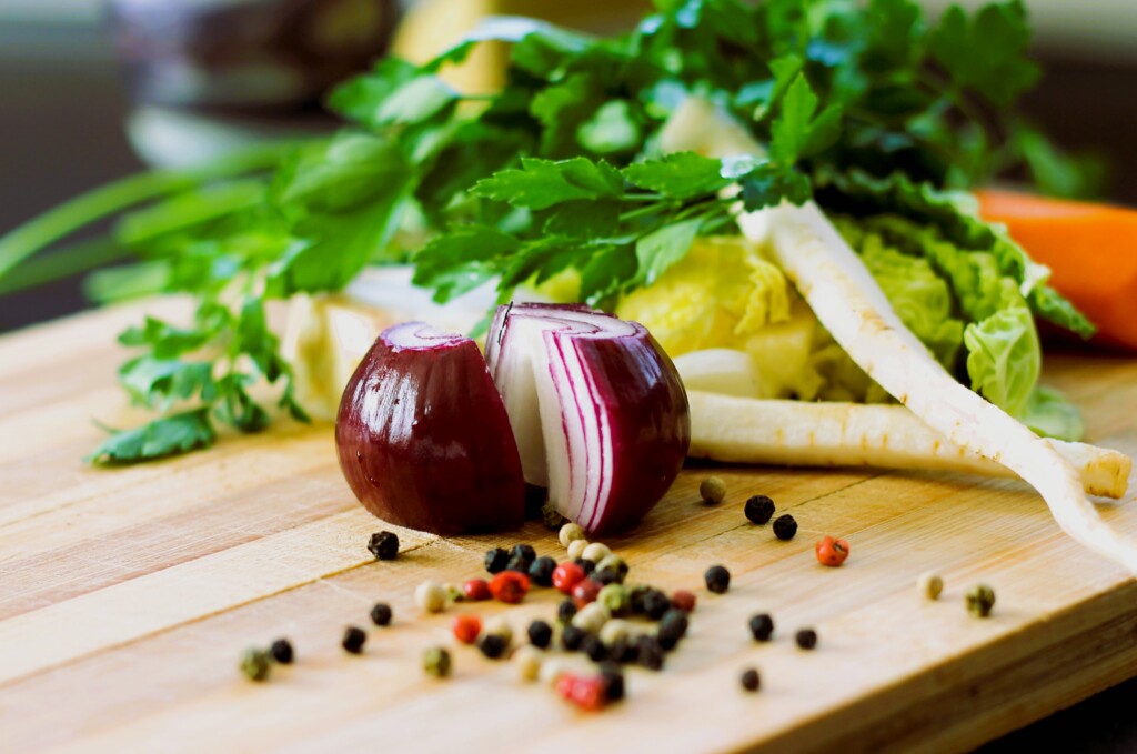 Chopped onion and veggies on cutting board