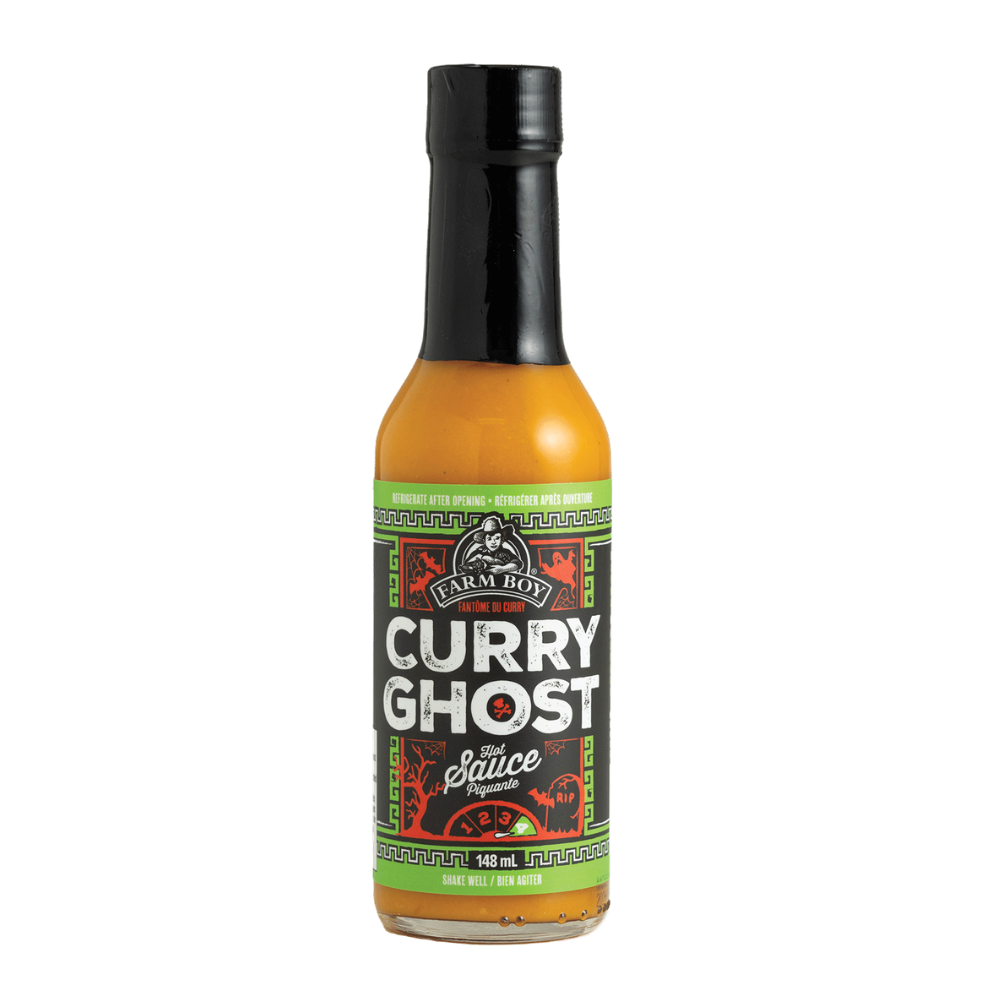 Bottle of Farm Boy Curry Gjost Hot Sauce on white background