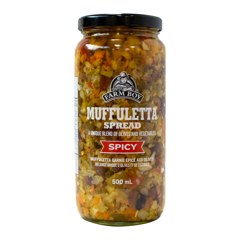 Tall jar of Spicy Muffuletta on white background
