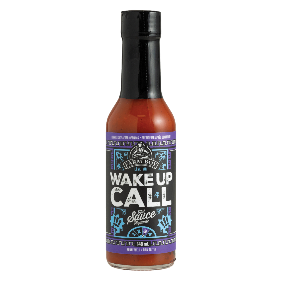 Bottle of Farm Boy Wake Up Call Hot Sauce on white background