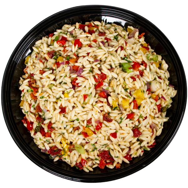 Top view of black bow filled with orzo pasta salad with bell peppers and sundried tomatoes