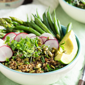 Warm Quinoa Bean Asparagus Salad in a white bowl.