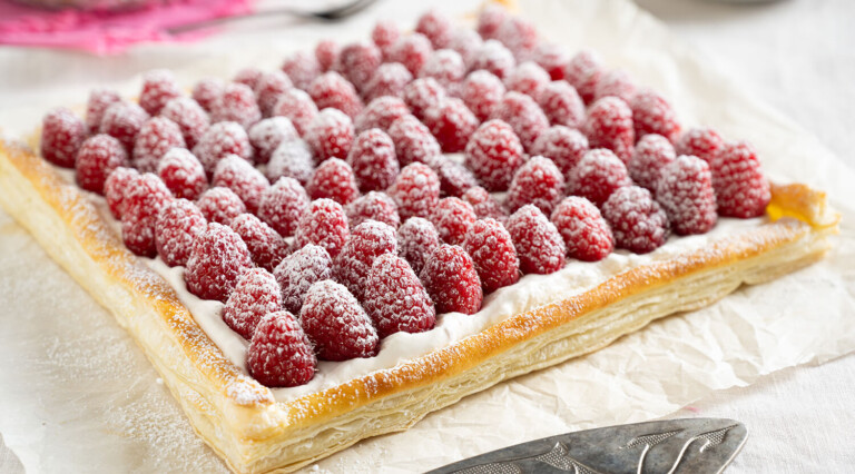 Creamy Raspberry Tart with a Whisper of Icing Sugar.