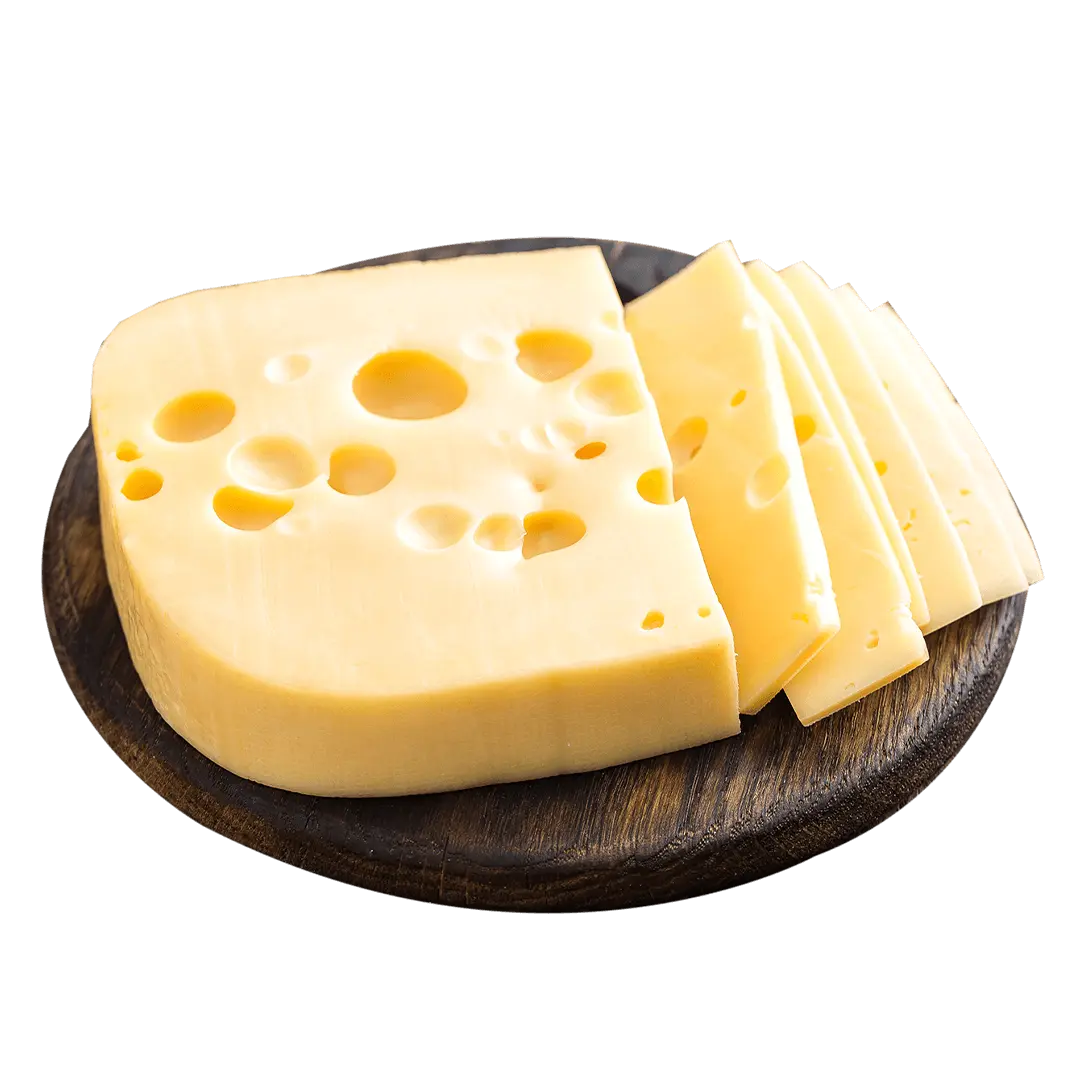 Slices of Swiss Cheese on a board. 