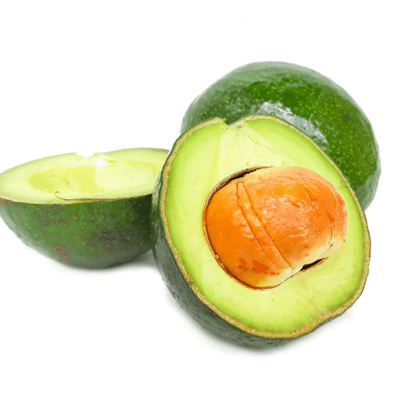 Caribbean fruit: Whole and sliced green avocado on white background.