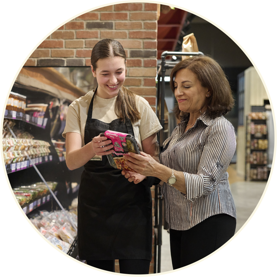 Farm Boy employee helping a customer
