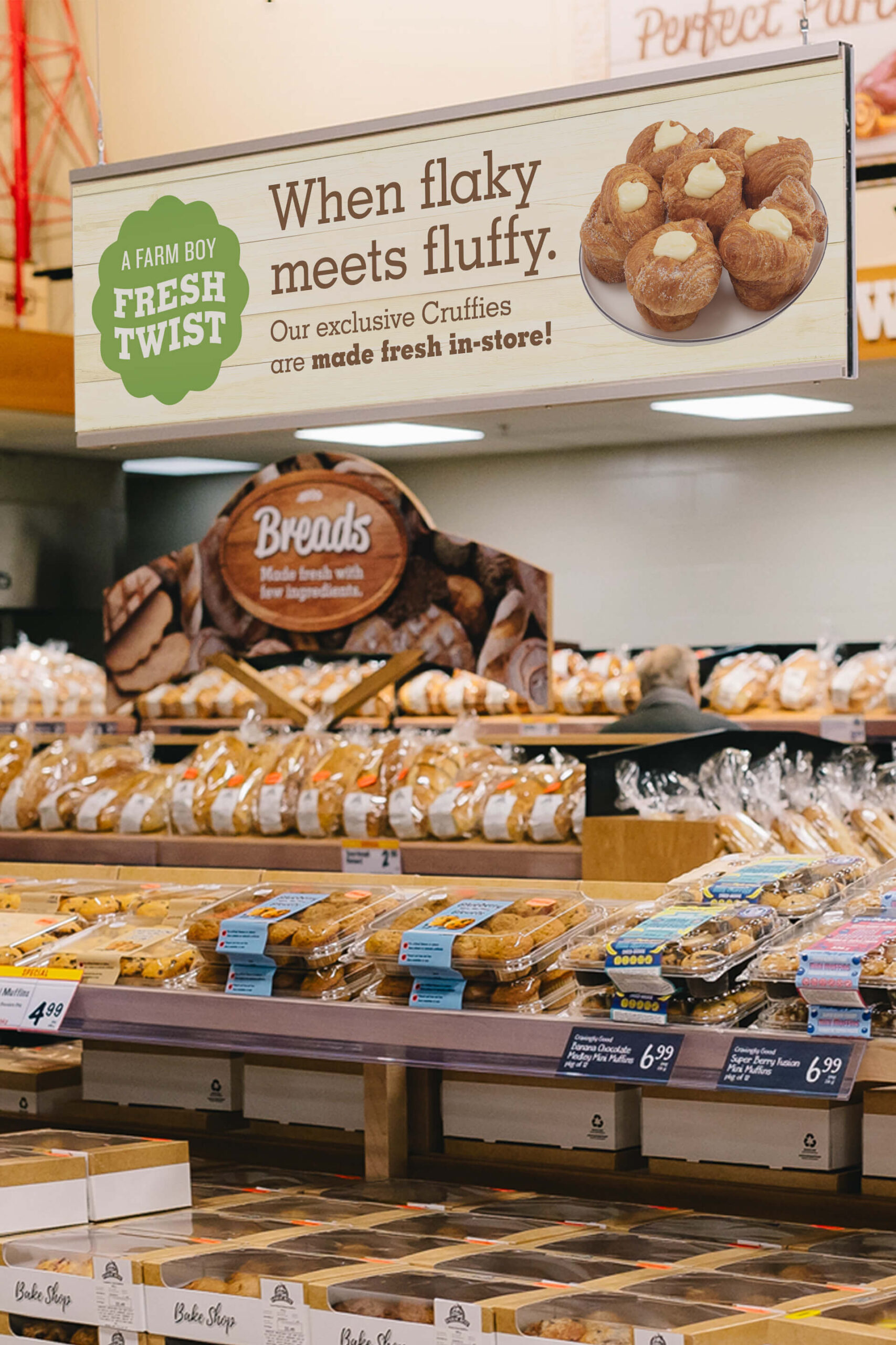 A sign hanging in a Farm Boy store talking about how cruffies are made fresh in-stores.