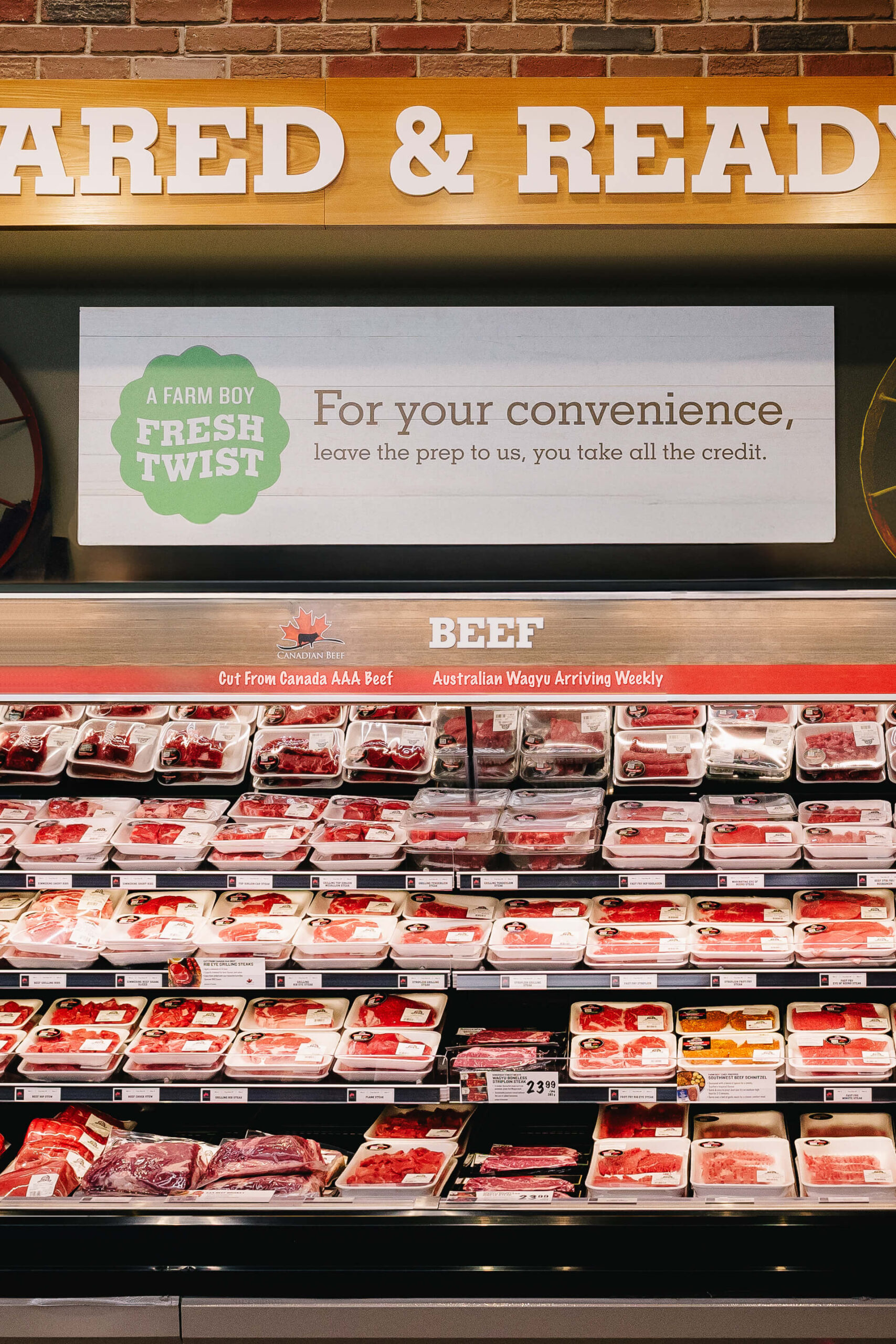 Sign hanging in a store talking about how we do all the prep when it comes to the meats sold at Farm Boy stores.