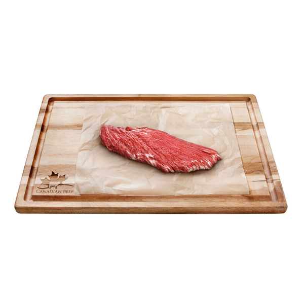 Image of cutting board with beef flank steak