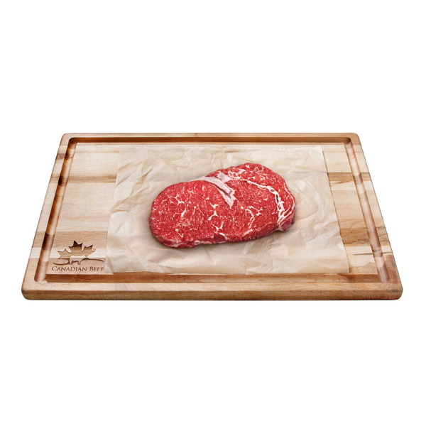 Cutting board with rib eye steak