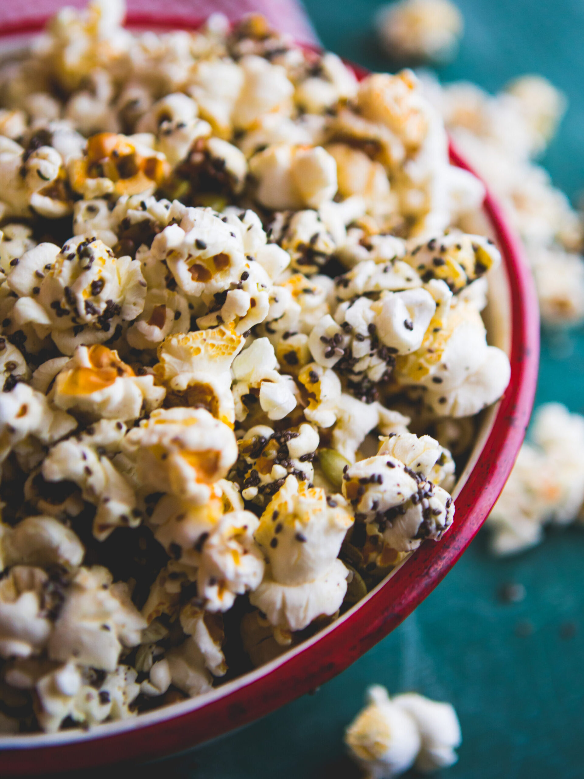 Homemade popcorn filled with spices and grains. Perfect snack for movie days at home.