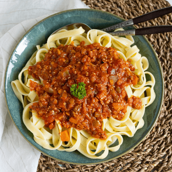 Plate of pasta with red lentil ragu