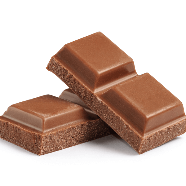 Squares of milk chocolate on white background