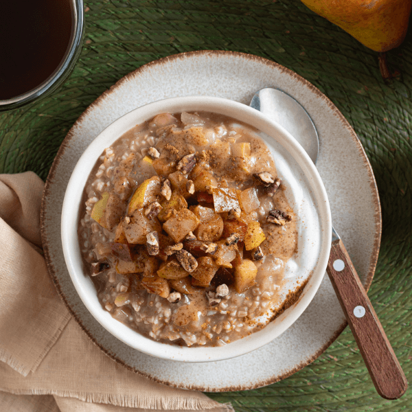Overhead image of bowl of apple-pear steel cut oats for Thanksgiving brunch