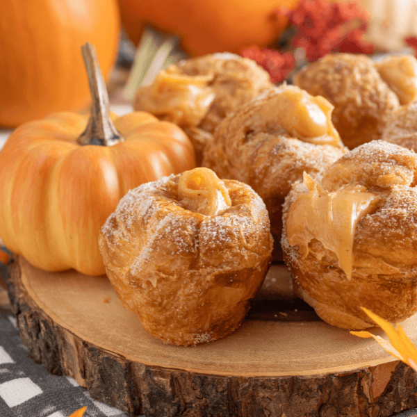 Cross-section of log with Farm Boy Pumpkin Spice Cruffies and decorative pumpkin