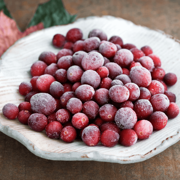 "Frosty cranberries in a bowl. Shallow dof, extremely sharp focus."