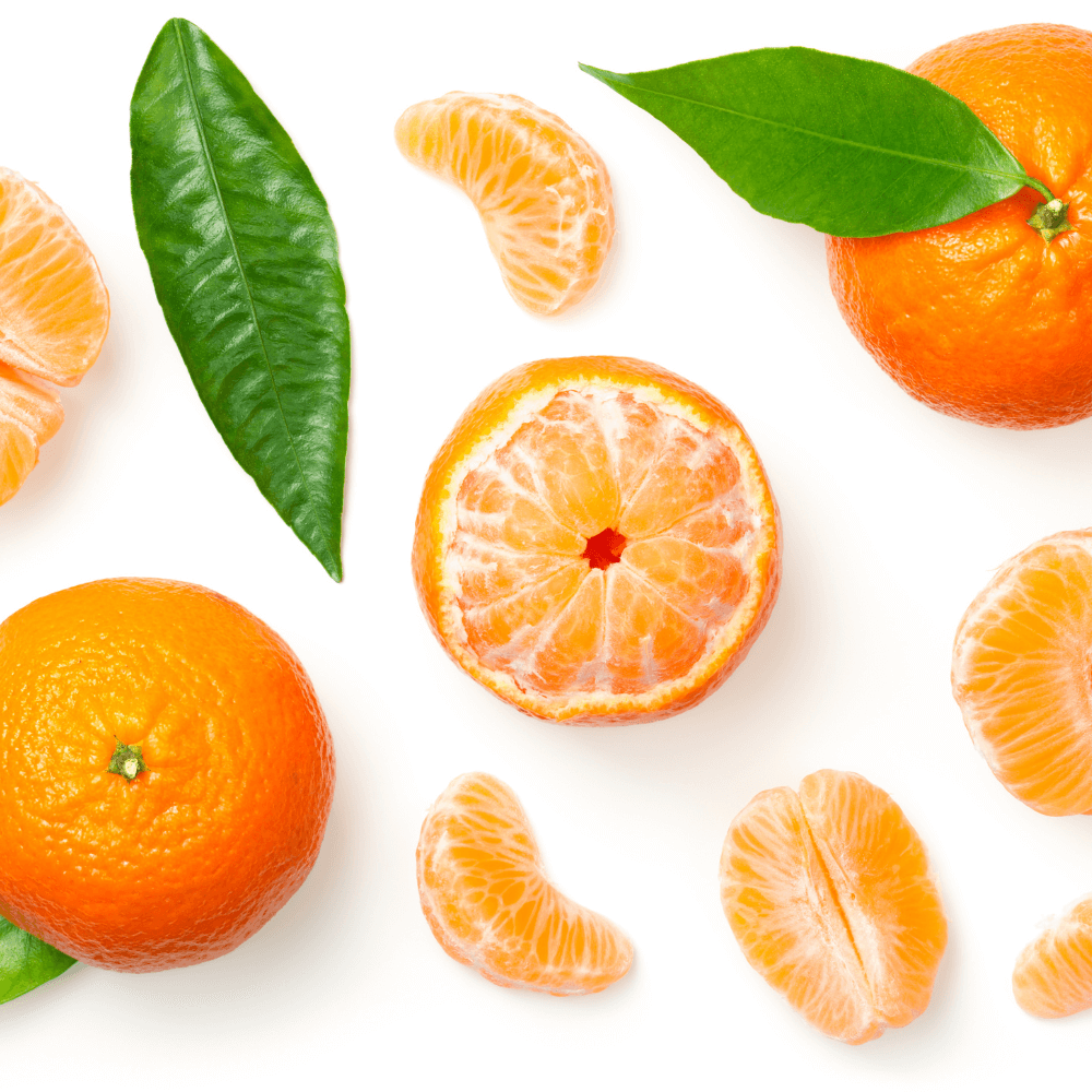 Whole and segmented clementines on white background