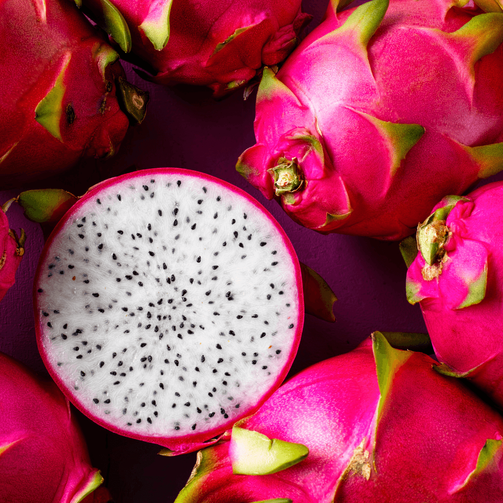 Pile of whole dragonfruits with one cut in half