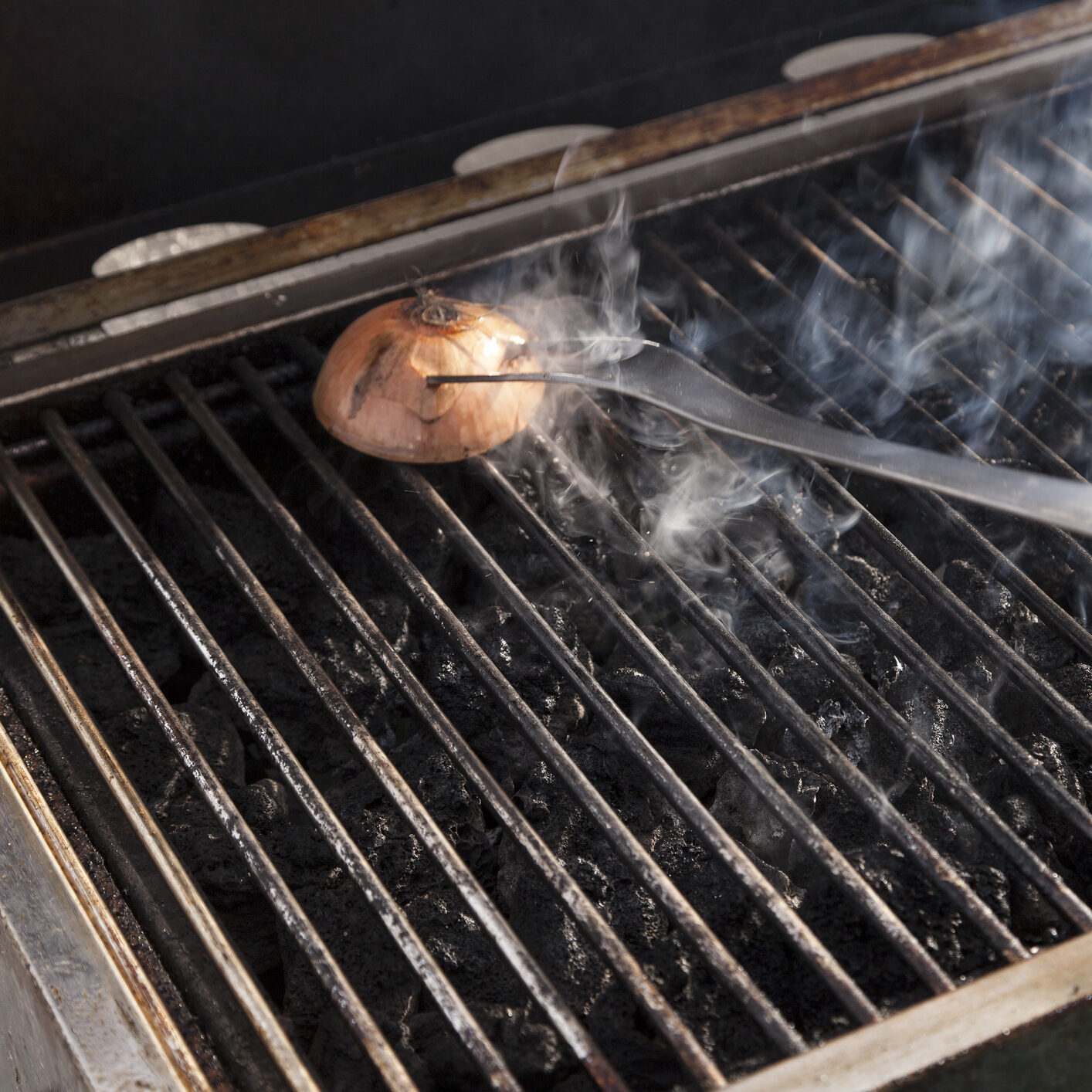 Using onion and grill fork to clean grates