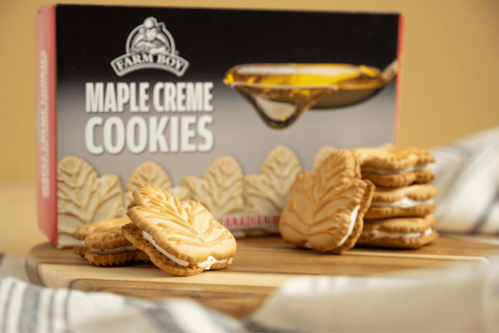 Farm Boy Maple Leaf Creme Cookies box with maple leaf cookies in foreground