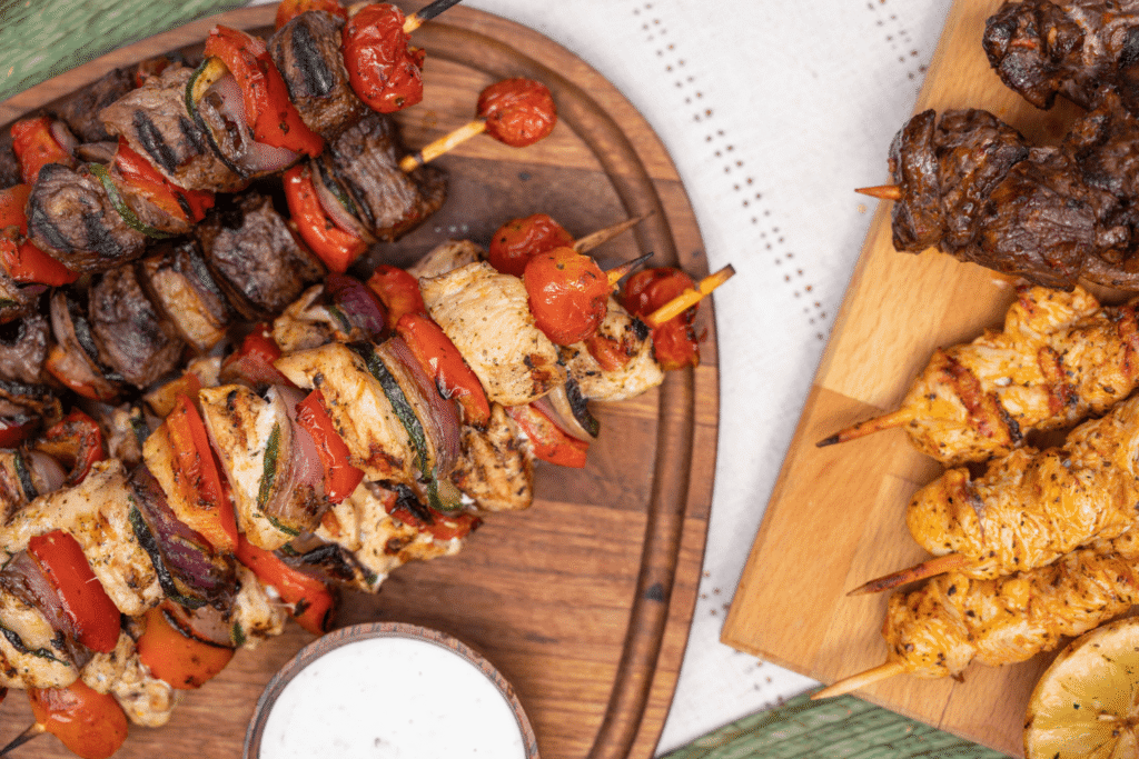 Overhead image of assorted barbecued kebabs with meat and vegetables for a summer BBQ