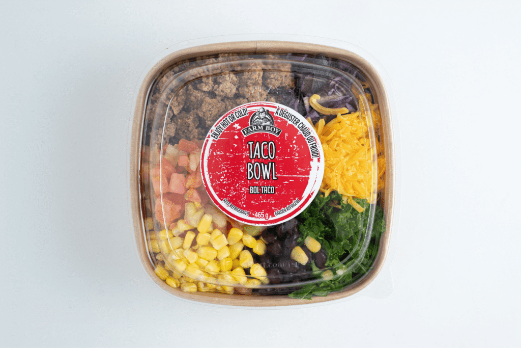top view Farm Boy Taco Bowl with ground beef, corn, tomatoes, cheese, and kale for healthy lunch